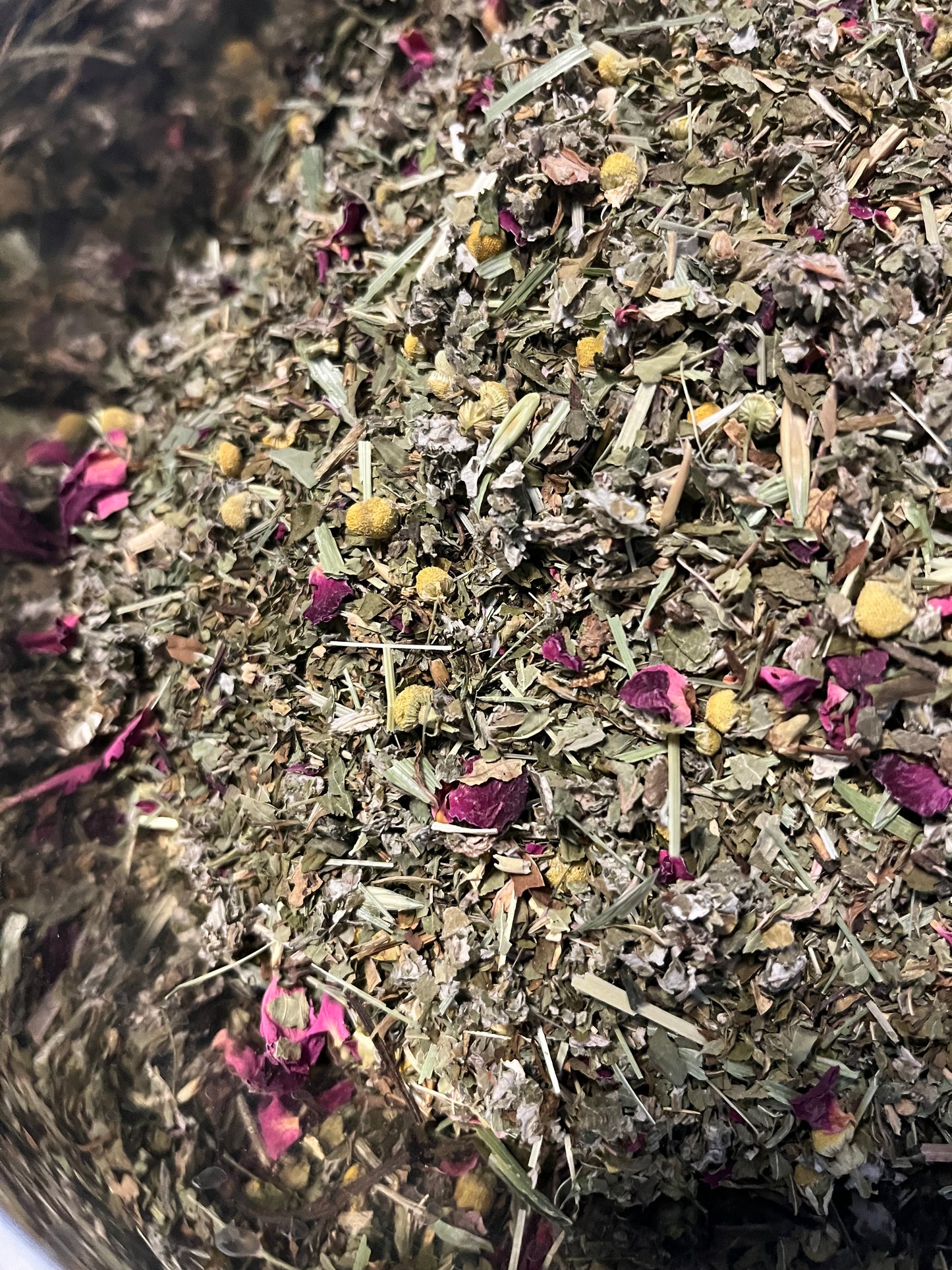 picture of loose leaf tea blend called..red yellow and green colors with a stainless steel background
